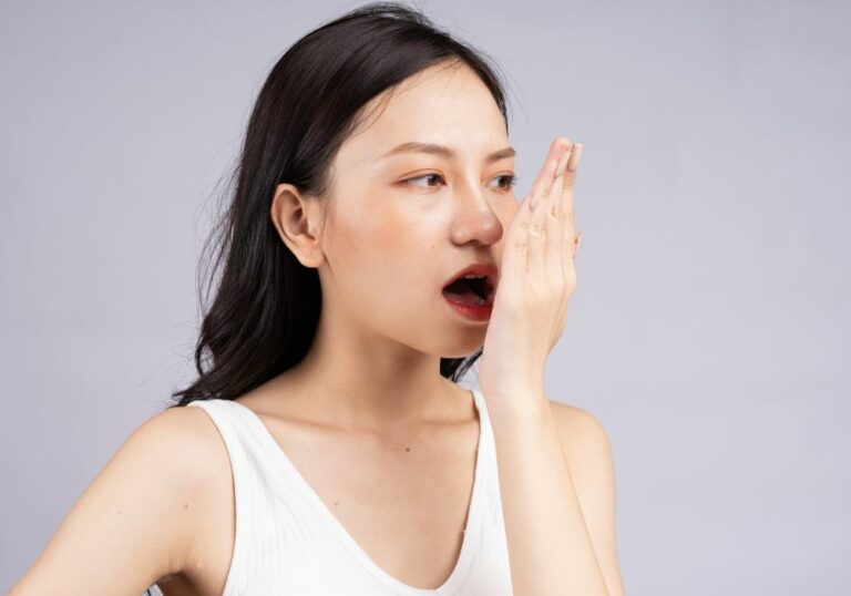 Why Does My Breath Smell Like Poop Even After I Brush My Teeth? (9 Reasons)