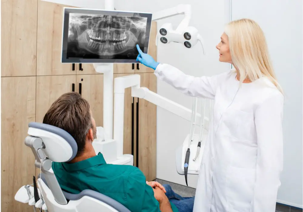 What complications can arise from impacted wisdom teeth?