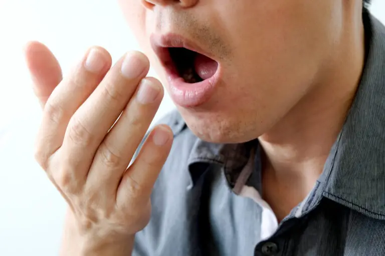 Why Does My Breath Smell Like Poop Even After I Brush My Teeth? (9 Reasons)