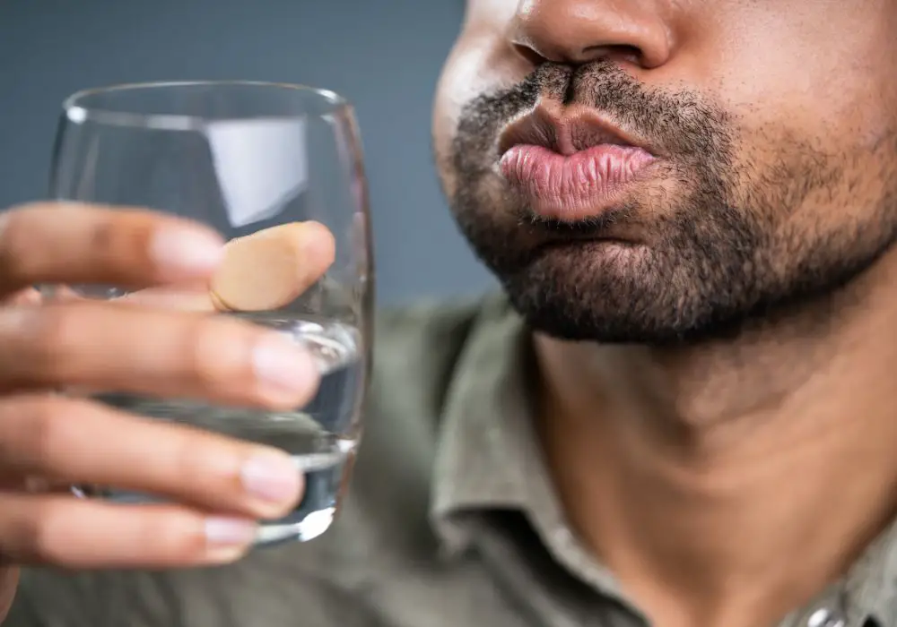 How long should I wait to brush after a salt water rinse?