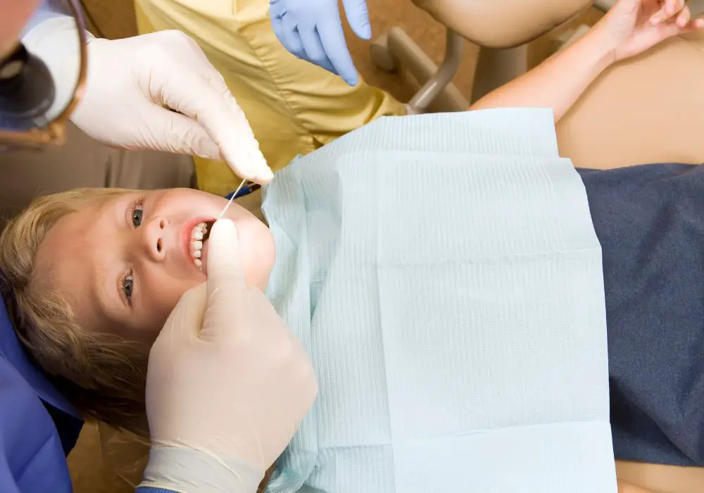 How to floss your toddler's teeth