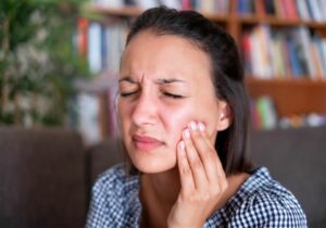 Why does my tooth feel pressure when I bite it? (Causes & Solutions)