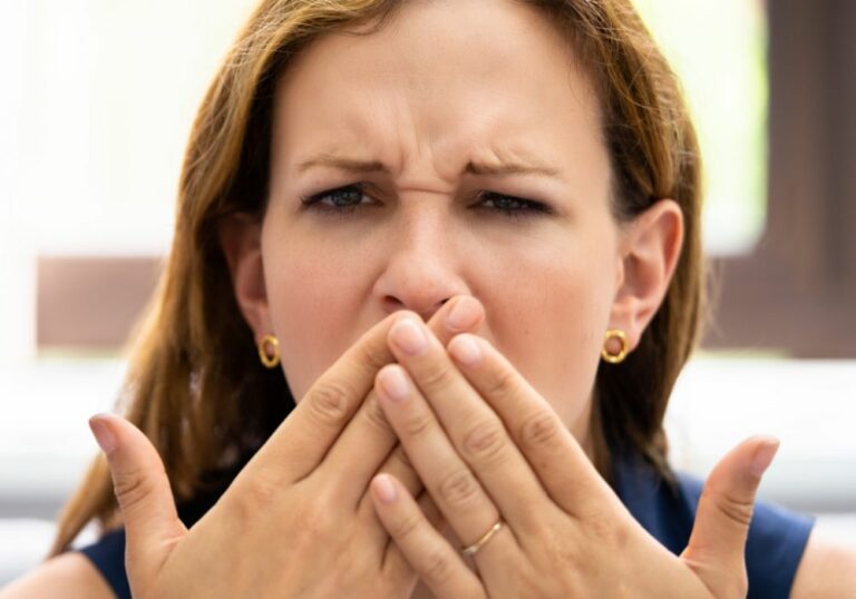 Why do I have a weird taste in my mouth days after wisdom teeth surgery?