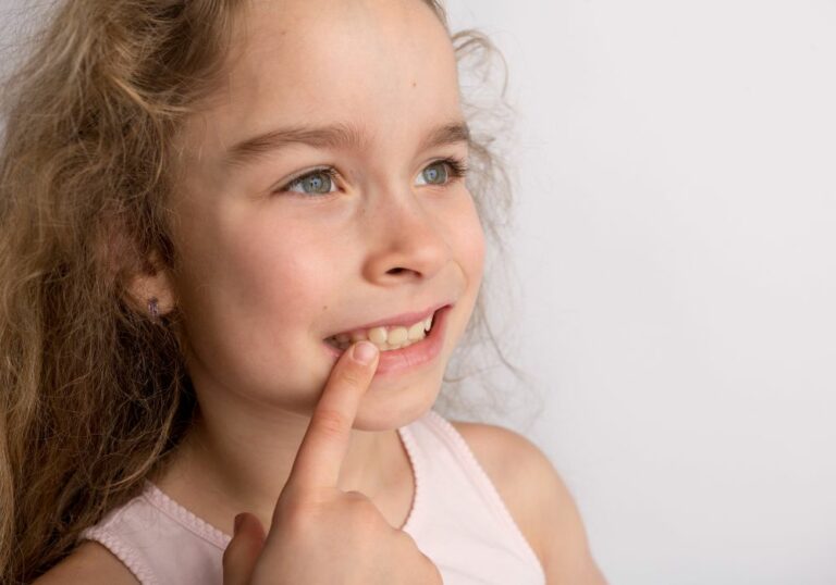 Why Can I Feel My Teeth Moving? (Causes & Treatment Options)