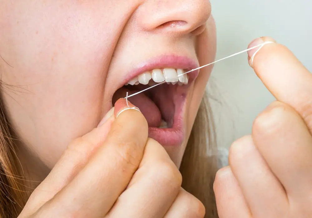 What Factors Lead to Grit Between Teeth During Flossing?