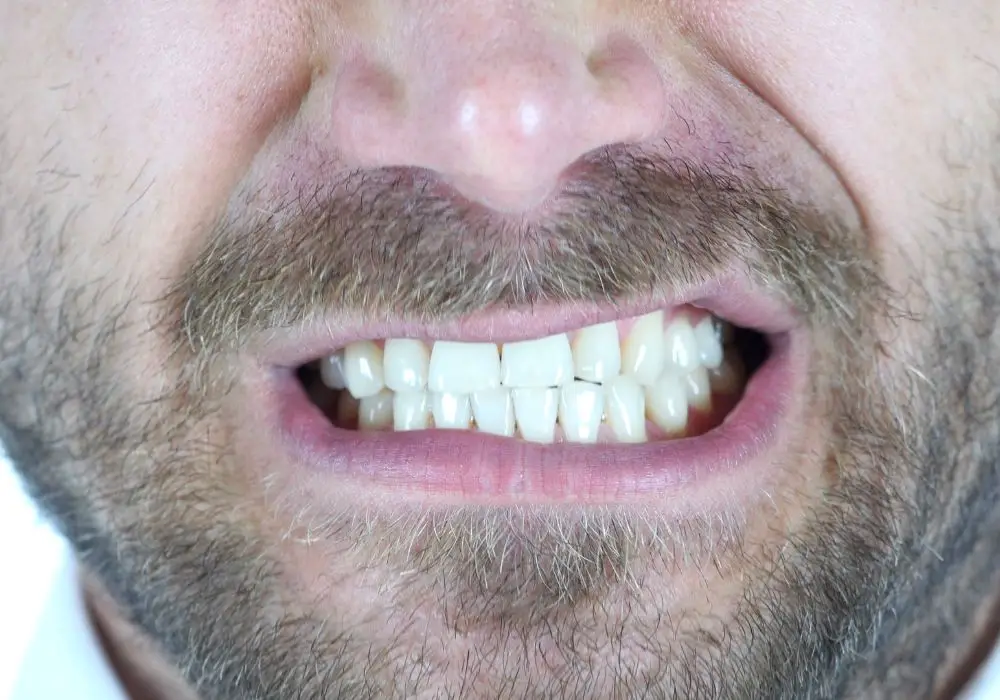What causes teeth grinding at night?