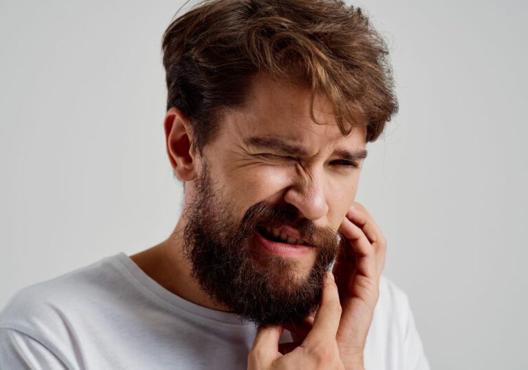 Why is my tooth still sensitive after a crown? (Causes & Solutions)