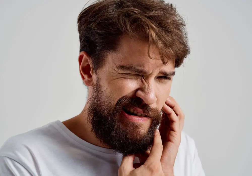 What causes tooth sensitivity after a crown procedure?