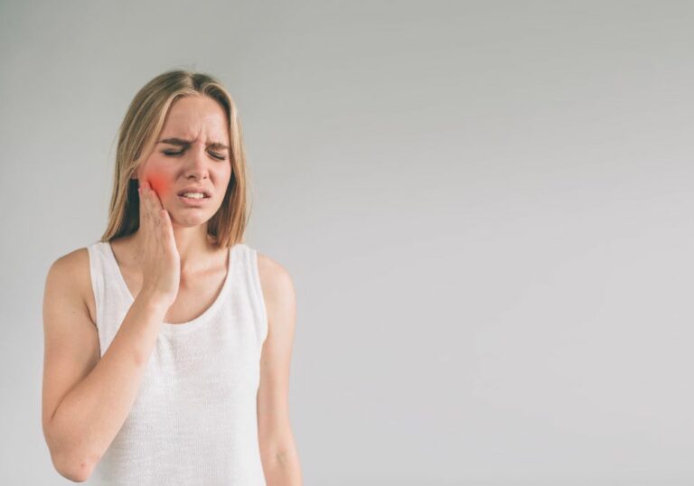 Why do I get random sharp pain between my teeth? (Causes & Solutions)