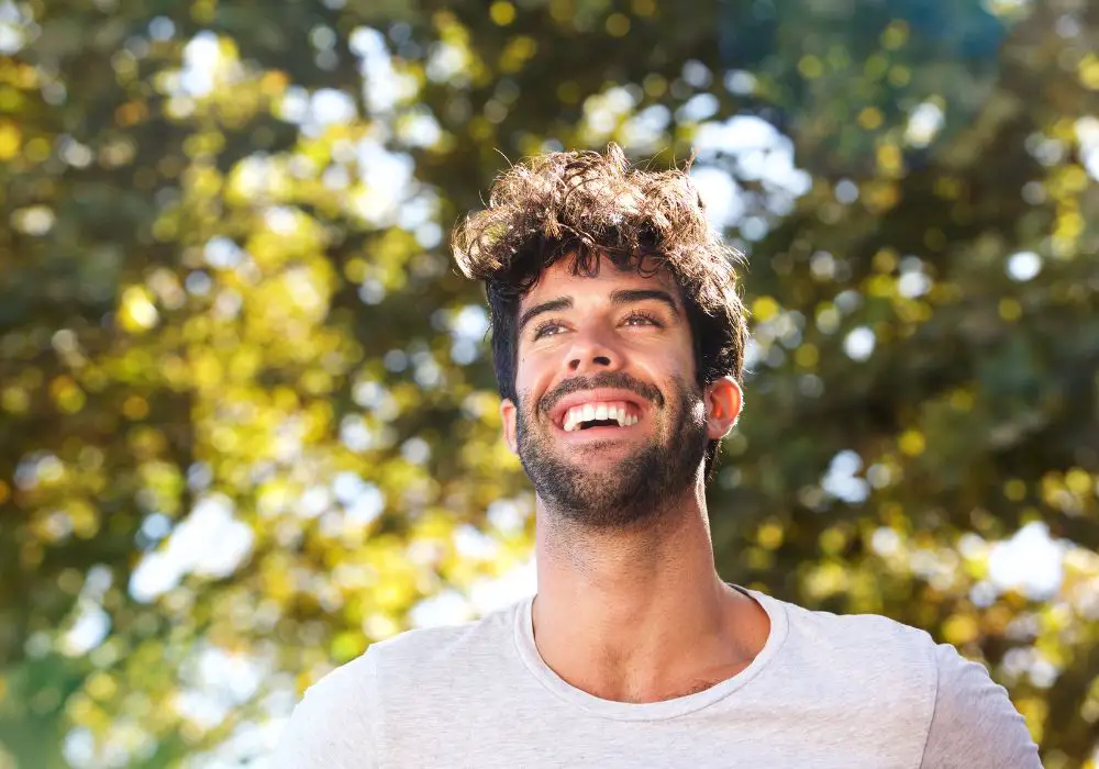 When are teeth shown in different types of smiles