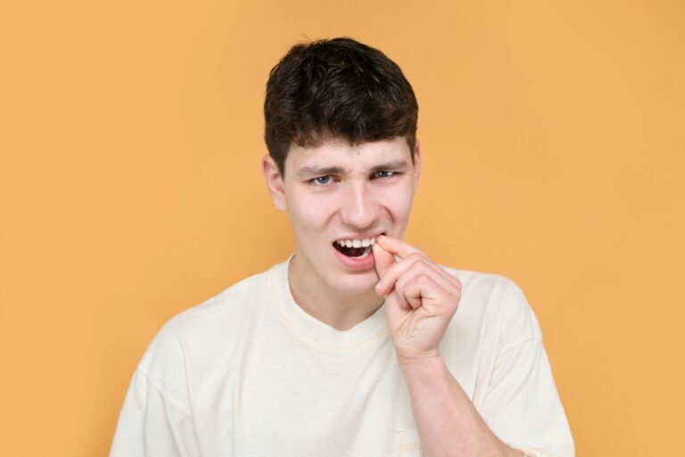 Why Do My 2 Front Teeth Hurt When I Bite? (Causes & Treatments)