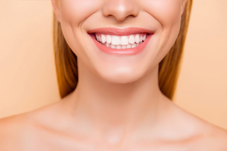 Why Are My Upper Front Teeth Bigger? (Causes & Treatment)
