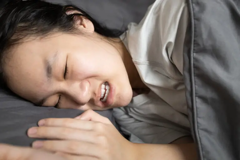 Why Do I Clench My Teeth When I Sleep? (Causes & Treatment Options)
