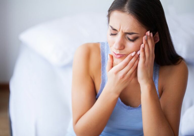 Why do I get random sharp pain between my teeth? (Causes & Solutions)