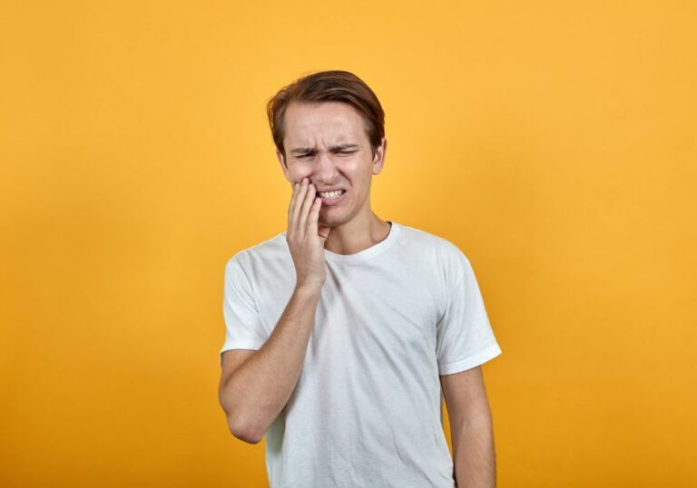 Why do my teeth hurt when I get hit in the face? (Causes & Solutions)