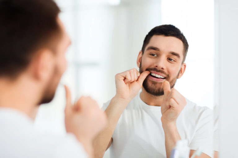 Why does food keep getting stuck between my gum and tooth?