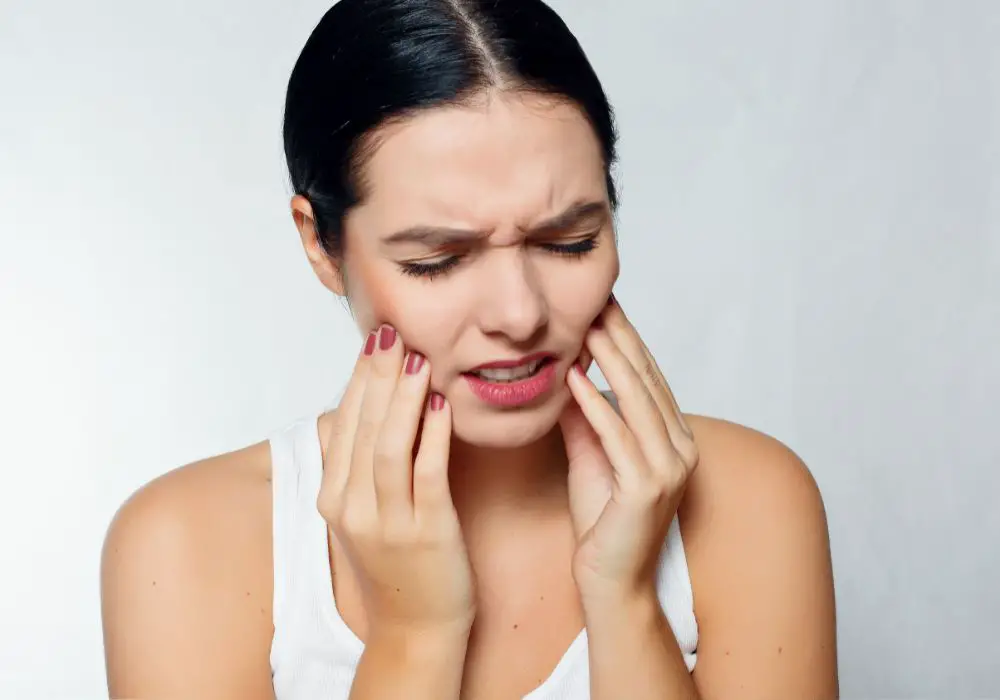 Why does my tooth feel pressure when I bite it? (Causes & Solutions)