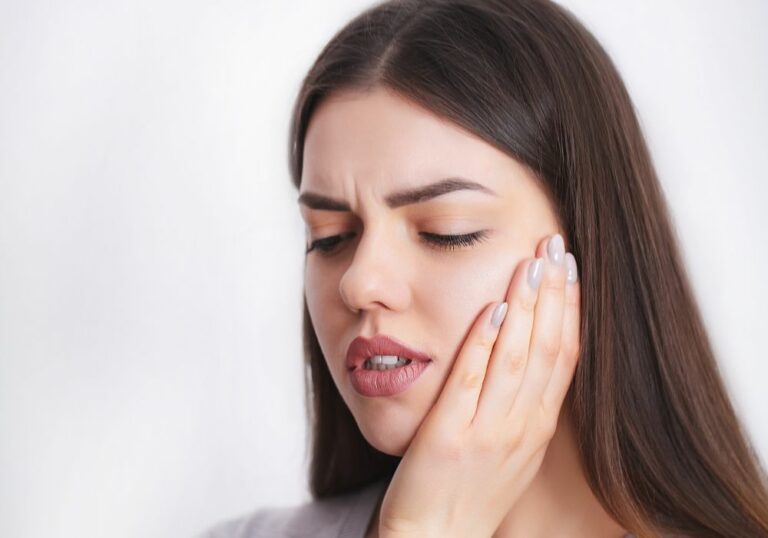 Why Does My Wisdom Tooth Hurt? (Signs & Causes)