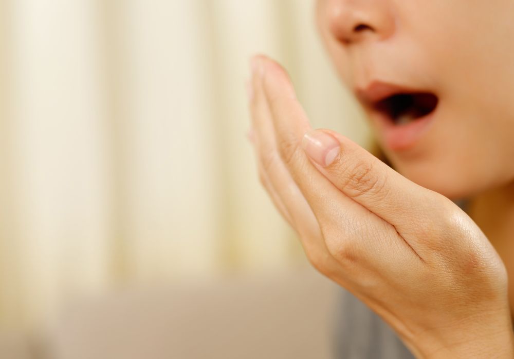 Why does wisdom teeth removal cause bad tasting saliva