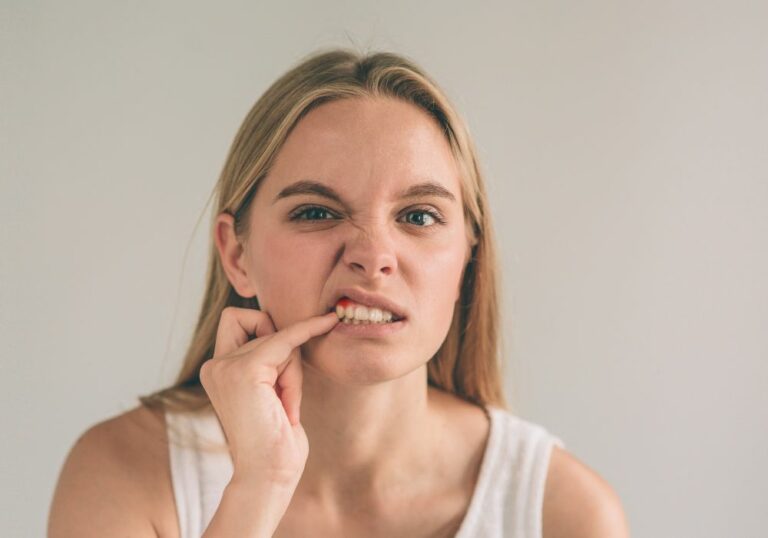 Why is my gum disappearing between my teeth? (Causes & Solutions)