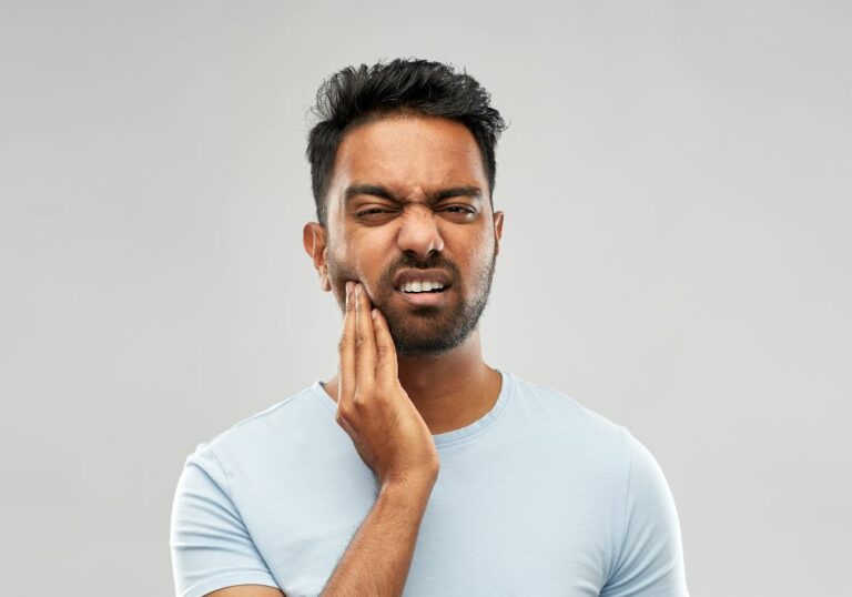 Why is my tooth still sensitive after a crown? (Causes & Solutions)